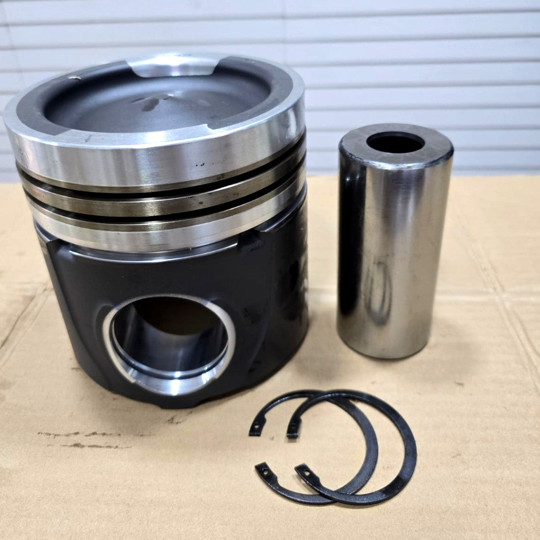 Engine piston with pin and circlips